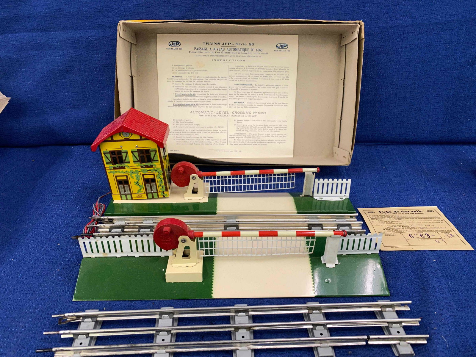 Jeep Toy Train Metal Crossing: Jeep Series 60, Metal Powered Train Crossing O Gauge, made in France, new in box. MFG. 65, 1958.