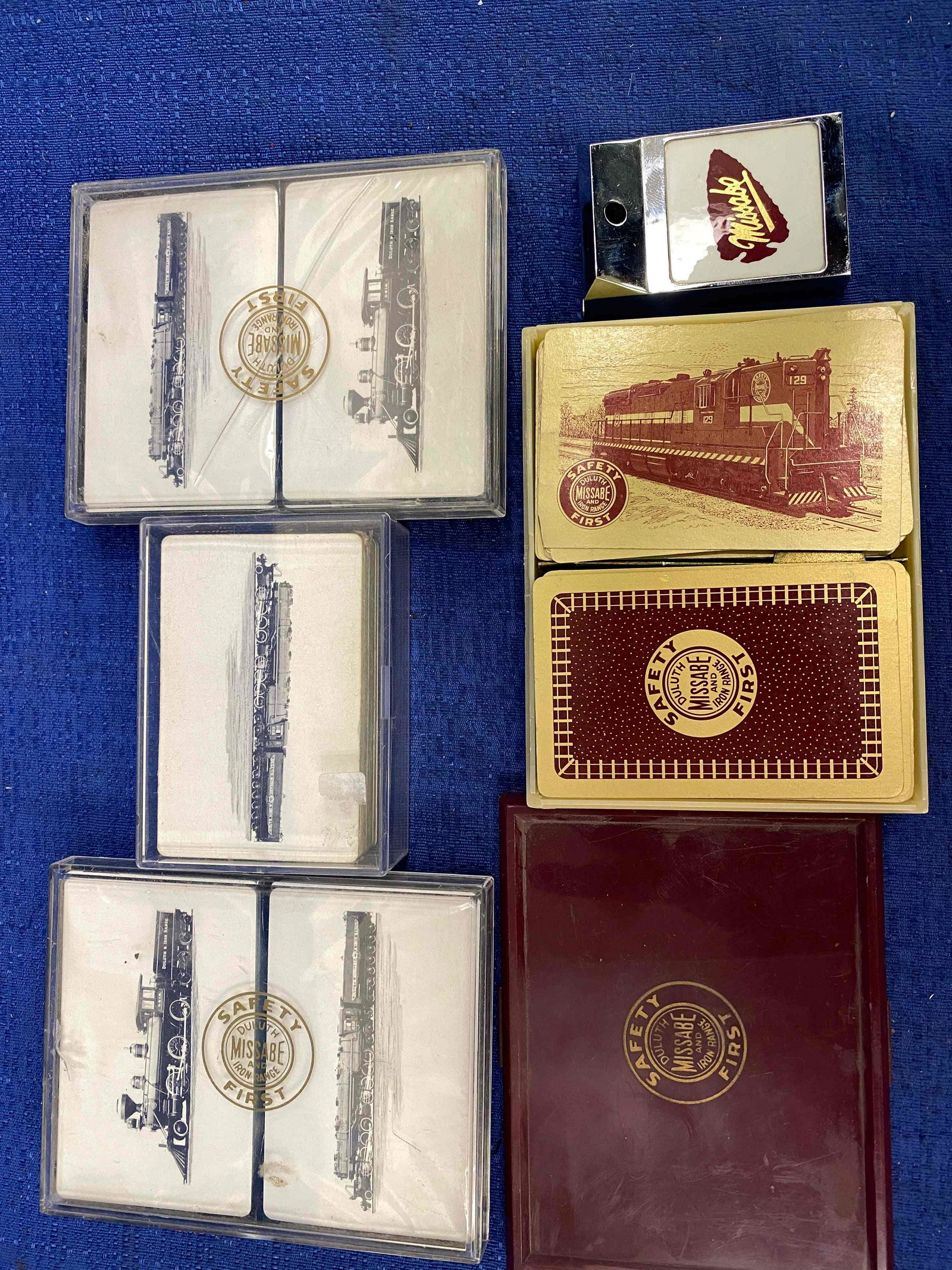 Duluth Missabe & Iron Range Playing Cards and Tape: Duluth Missabe & Iron Range Playing Cards and Tape Measure. 7 decks of cards, 4 decks still in seal. 1 chrome 72" tape measure.
