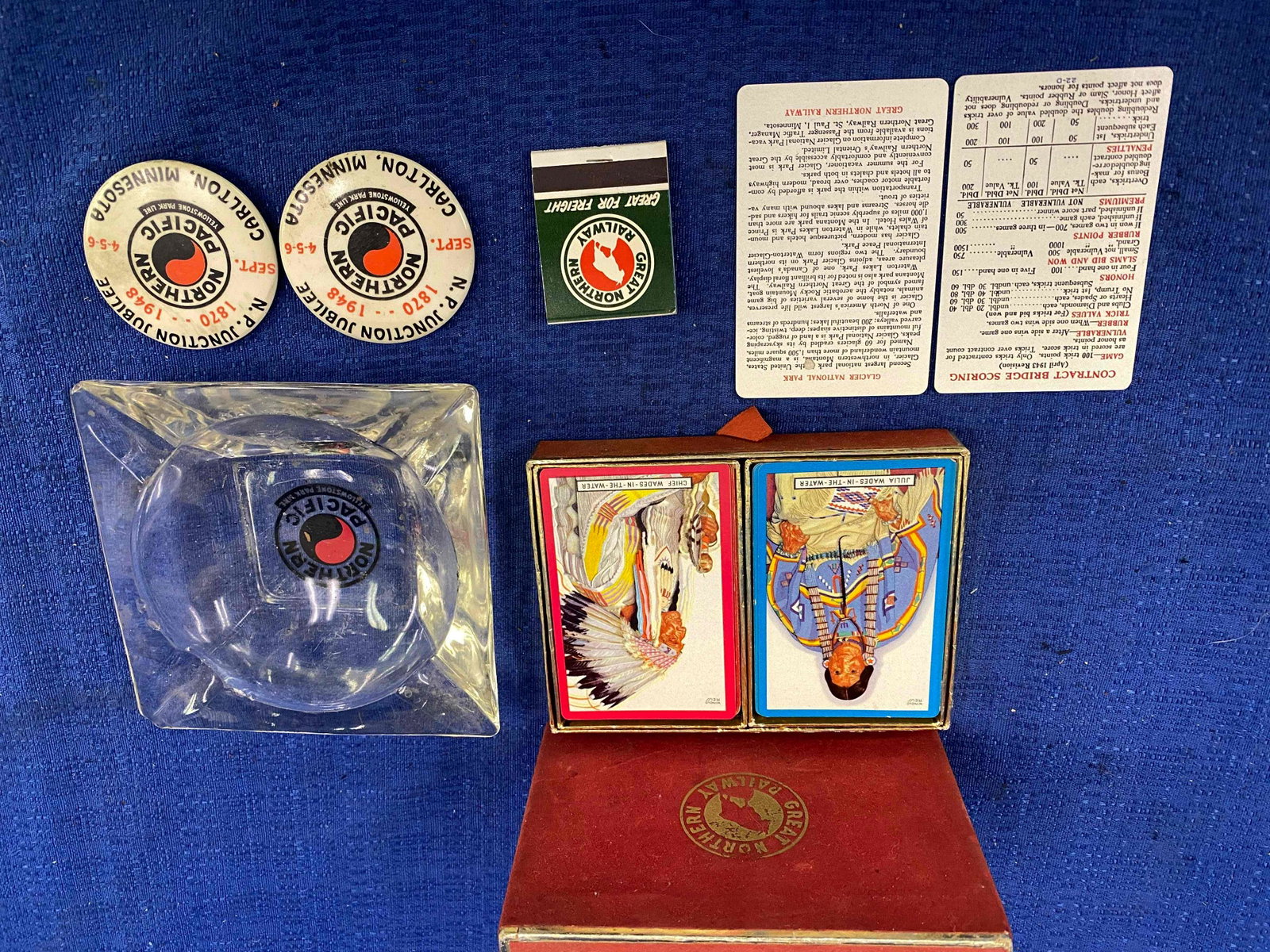 Northern Pacific & Great Northern Railway Items: Northern Pacific & Great Northern Railway, 1 double pack of Great Northern playing cards, 1 Great Northern paper match book, 1 Northern Pacific glass ash tray, 2 Northern Pacific pins.