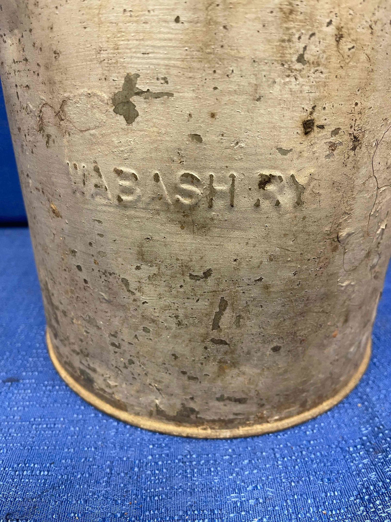Wabash Railroad Hinged Top Water Can with Wood Handle: This is a Wabash Railroad hinged top water can with wood handle and painted gray. "WABASH RY" is clearly cast into the side of the can. Main body is 8" wide and 8" high