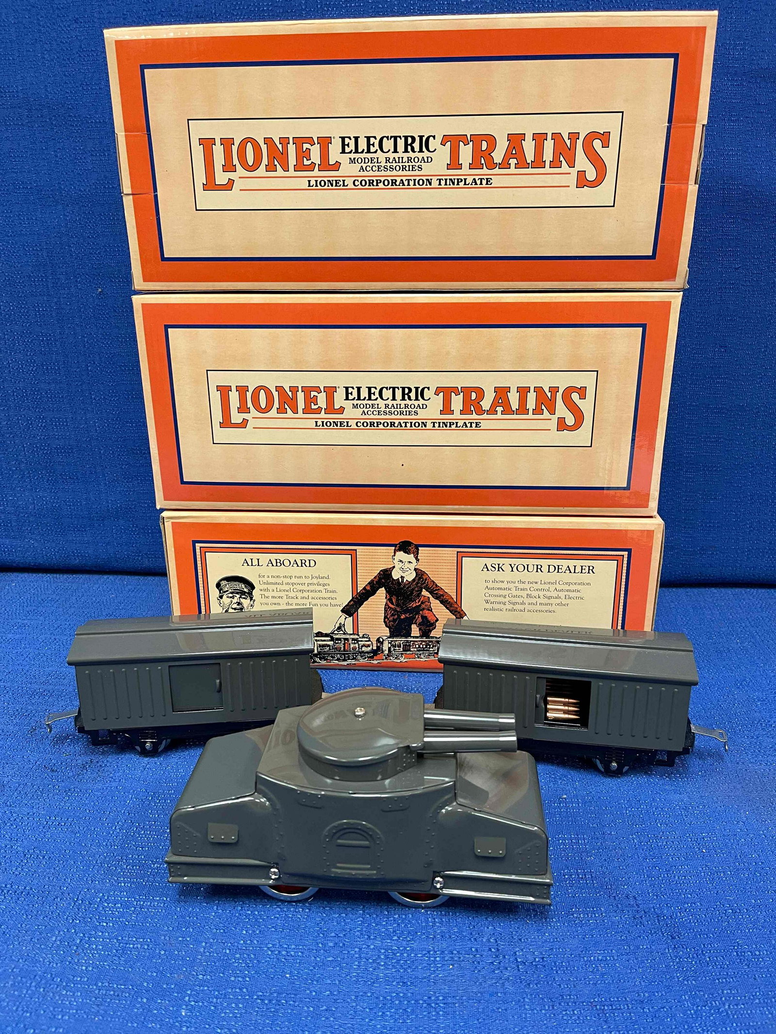 3 Lionel O scale Steel Body Arm Freight Cars: One No. 203 Armored Motorcar; Two No. 900 Ammunition Cars. NEW in boxes. O Gauge.