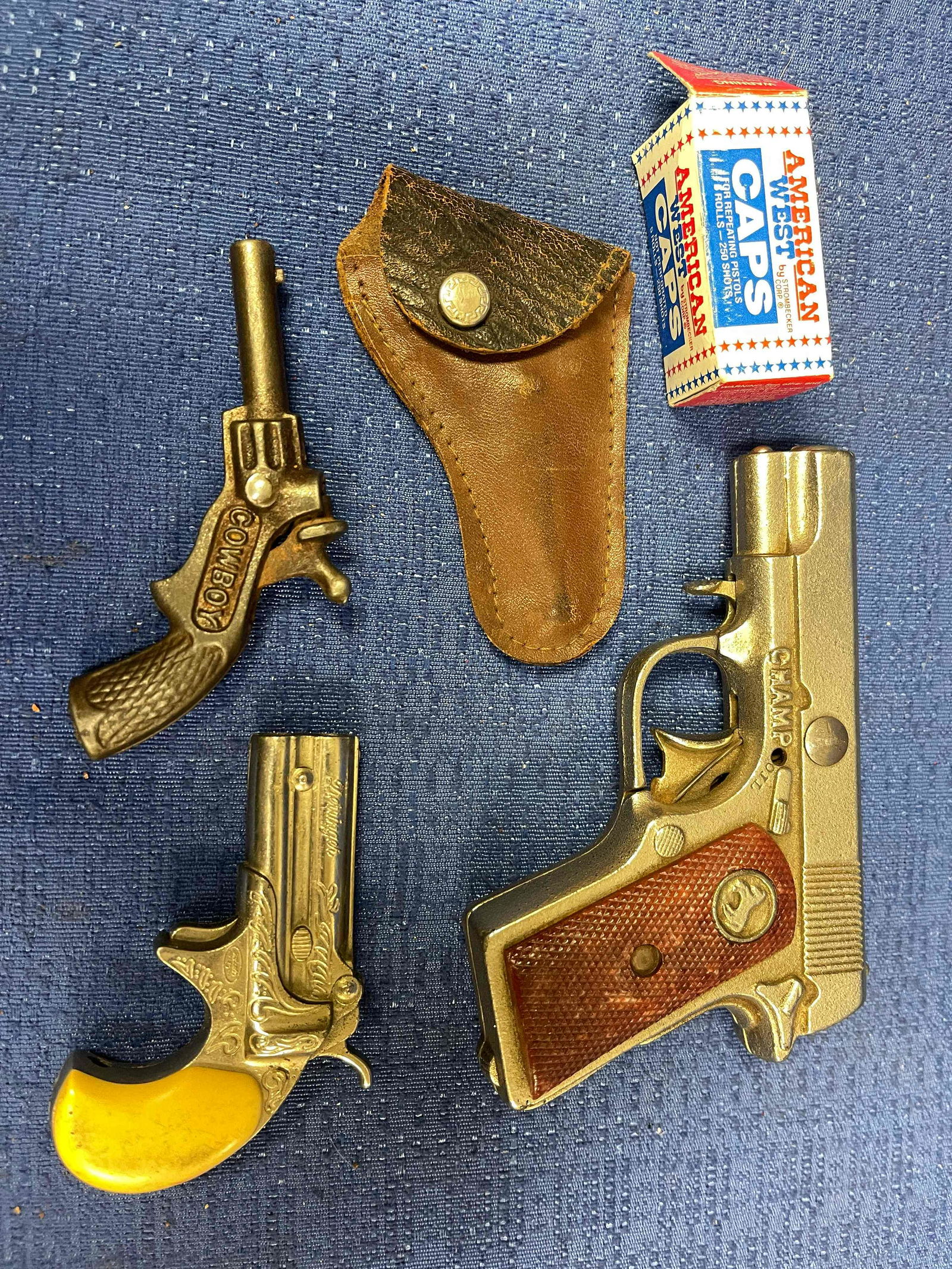 3 Vintage Cap Guns: One Hubley "Champ" Colt Code Mark Cast Iron, Cap Gun, U.S.A; One 1935 Steven's "Cowboy" Cast Iron Cap Iron; One Derringer, Japan, Redondo.