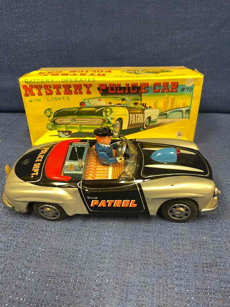 Vintage Battery-operated Mystery Police Car: Sanshin-Japan No. 70. with original box. Very nice piece! One very small scratch on fender. RARE!