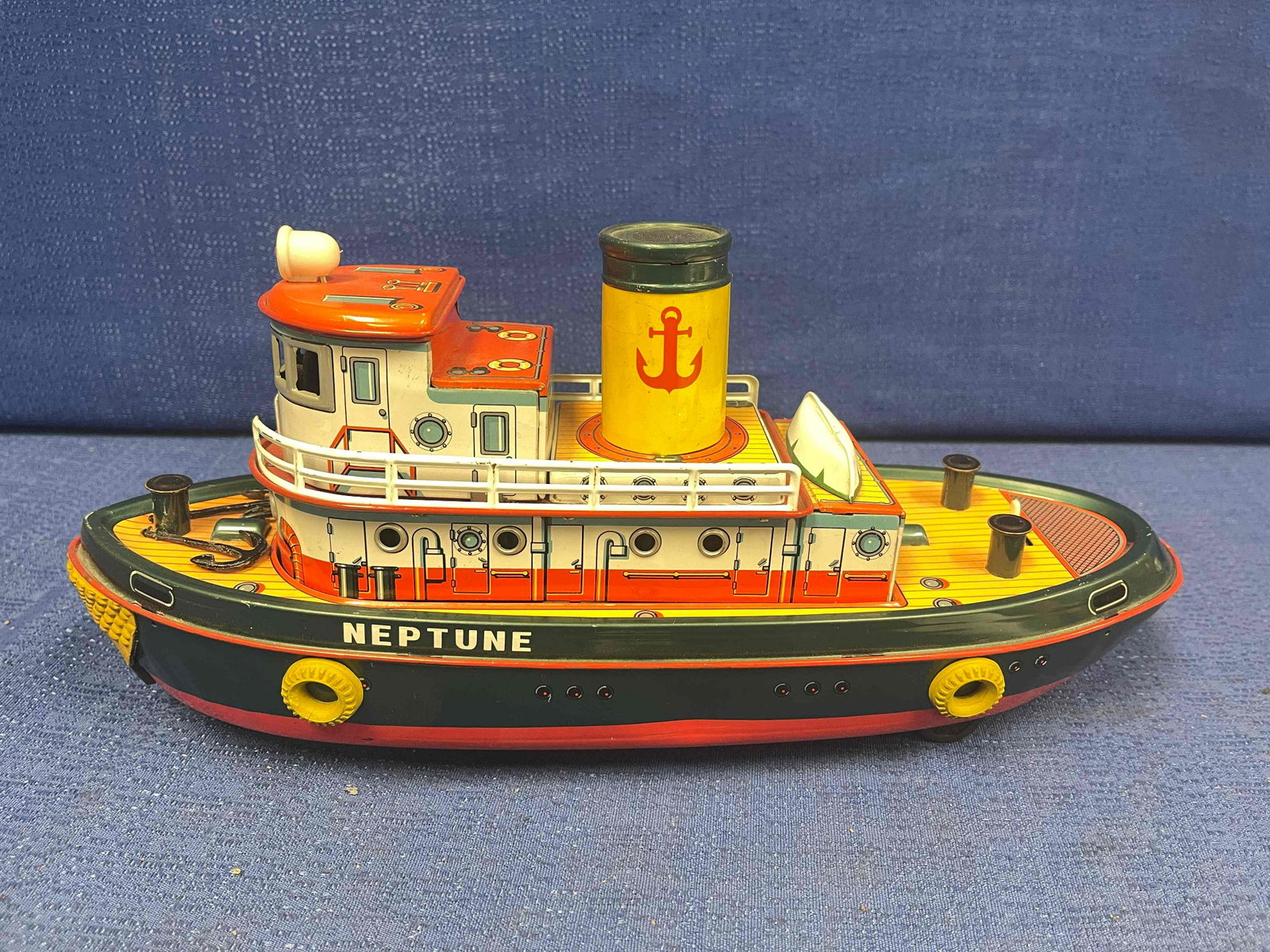 Modern Toys Tin Ship: Battery-operated Neptune. Lights, moves, and horn works. Very good condition. Made in Japan.