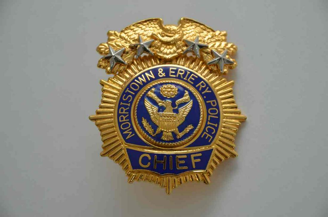 Morristown and Erie RR Police Chief Badge: An excellent police chief badge from the Morristown and Erie Railroad. Excellent like new metal. Manufactured by Smith and Warren. Needs a new pin on the back.