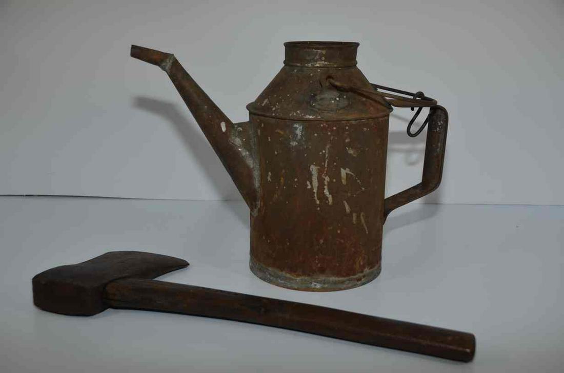 Chicago and Northwestern RR Axe and Water Can: This is an axe and a water can from the Chicago and Northwestern Railroad, The axe is marked “CandNW” on the wooden handle, while the water can is marked “CandNW RY” on the sid