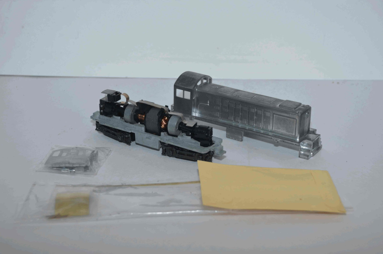Two Athearn Diesels-Undecorated-U33C and SW1500-HO Scale: This is a pair of Athearn Blue Box diesel that are undecorated, in kit form. One is a U33C and the other is a SW1500. Both have been tested and run well.