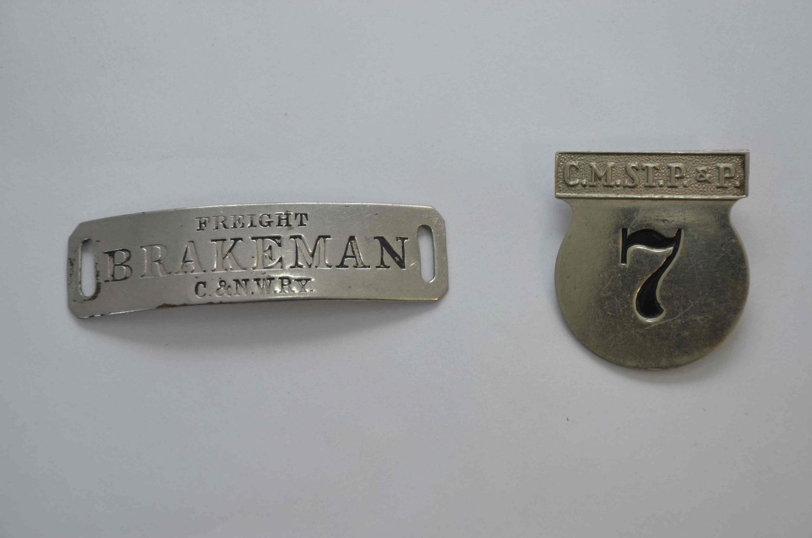 CNW RR Freight Brakeman Hat Badge and CMSTP and P RR Badge (1 of 2)