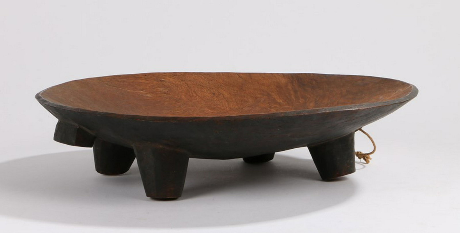 Fiji Kava bowl, raised on four cylindrical tapering: Fiji Kava bowl, raised on four cylindrical tapering legs, with hanging loop, 36.5cm diameter - Stock Ref:7146-3