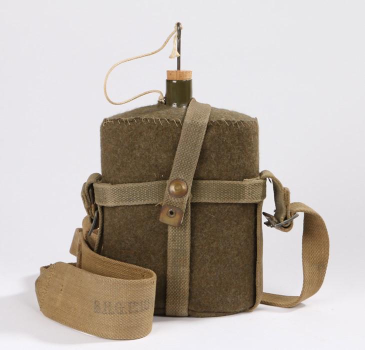Second World War British 1937 pattern water bottle and: Second World War British 1937 pattern water bottle and carrier, strap marked B.H.G. for Barrow, Hepburn and Gale of London, faint date appears to be 1942 - Stock Ref:8326-31