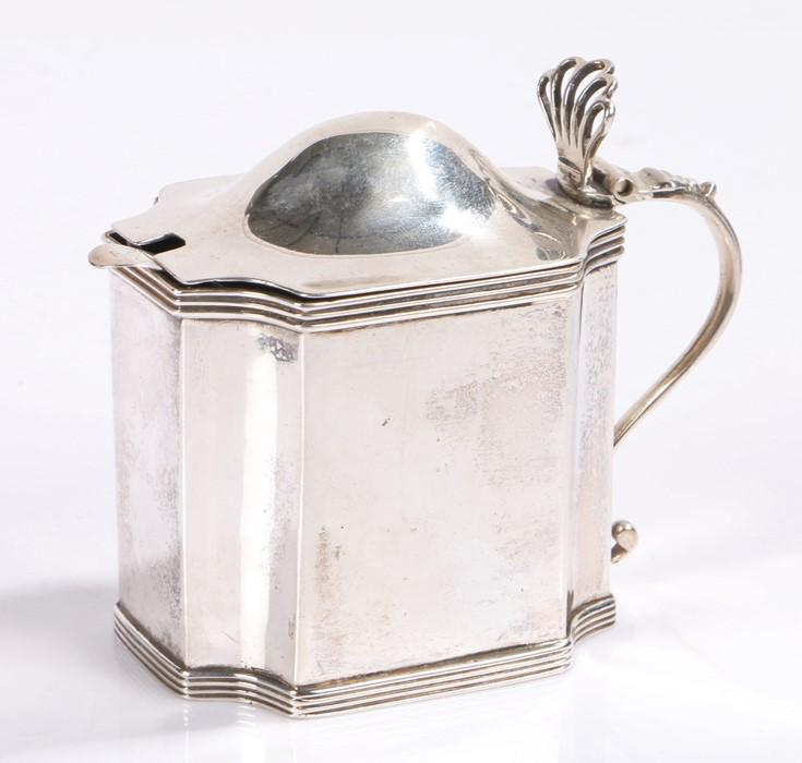 George III silver Mustard pot and cover, London 1798,: George III silver Mustard pot and cover, London 1798, maker Peter and Anne Bateman, the domed cover with pierced shell form thumb piece and scroll handle, blue glass liner, together with a George III 