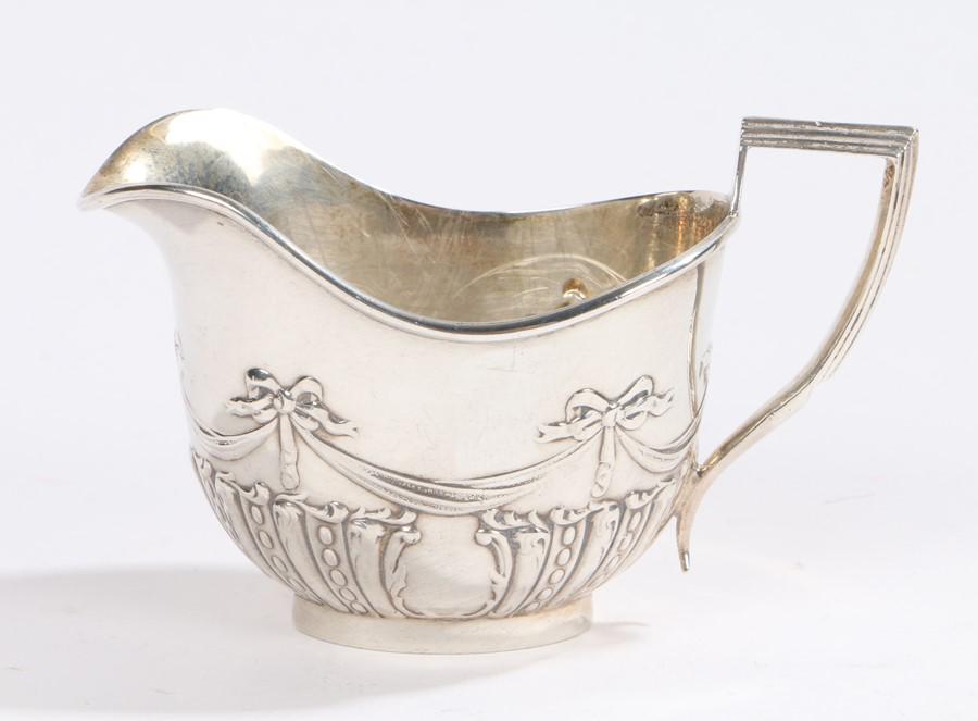George V silver milk jug, Birmingham 1922, maker Henry: George V silver milk jug, Birmingham 1922, maker Henry Matthews, with cast ribbon, swag and harebell gadrooned decoration, 1.7oz (2)