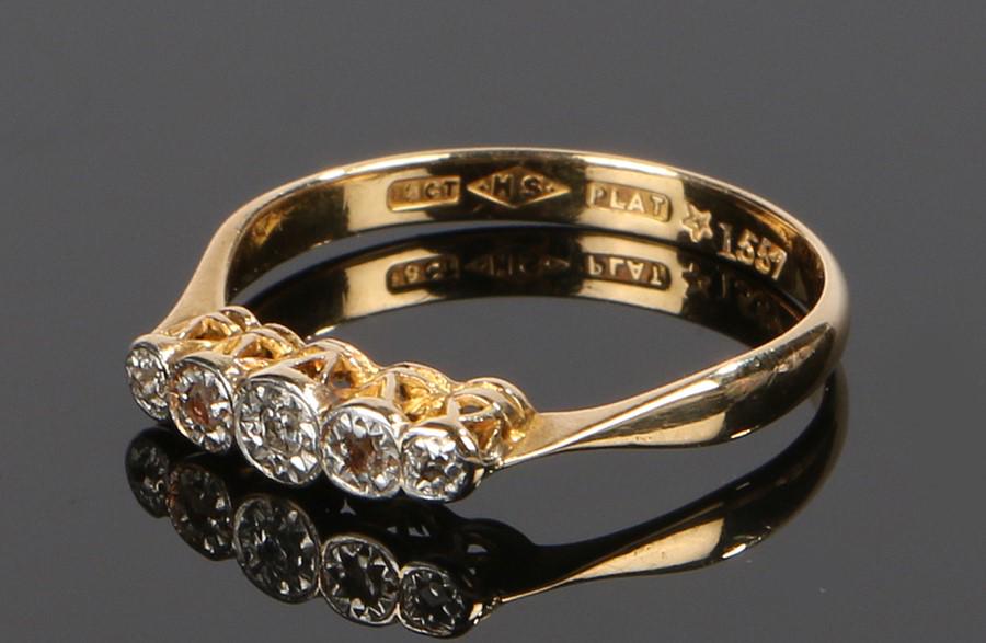 18 carat gold diamond set ring, the raised head with (1 of 1)