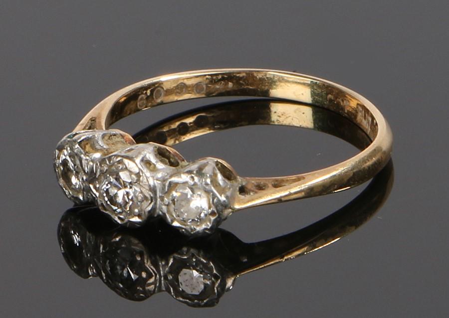 18 carat gold diamond ring, the head set with three (1 of 1)