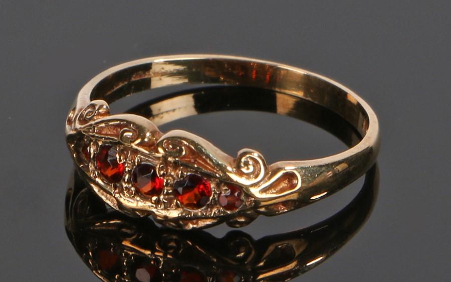 9 carat gold ring, the scroll head set with three (1 of 1)