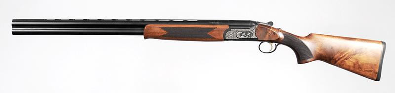 TR Imports Silver Eagle Over/Under Shotgun: 12 ga., 3 in. or shorter, 28 in. vent rib barrels, S/N 173810163, heavily engraved receiver, checkered wood stock