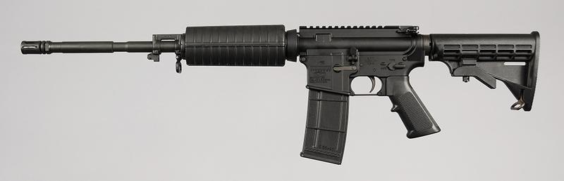 Bushmaster Model XM15-E2S Rifle: cal. 223-5.56 NATO, 18 in. barrel, S/N BFIT024180, collapsible stock, pistol grip, one magazine