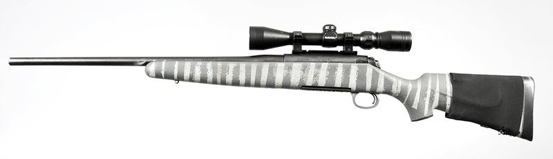 Remington Model 710 Bolt Action Rifle: .30-06 SPRG, 22 in. barrel, S/N 71096969, detachable box magazine, butt stock shell holder, with a Bushnell scope