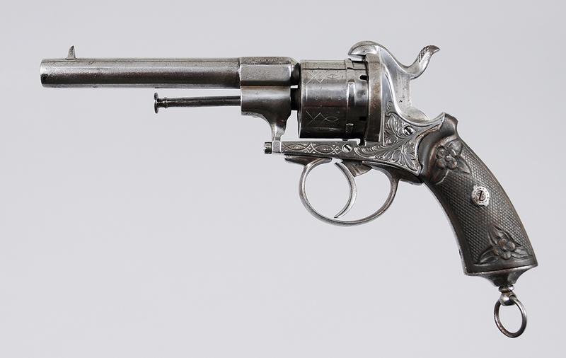 Continental Double Action Pinfire Revolver: possibly French, 6-shot, 4.75 in. barrel, floral engraved receiver, simple engraving on cylinder and barrel, decorative grips, conforming butt cap with lanyard ring, no markings found