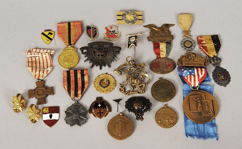 Misc. Pins and Badges: approximately 26 pieces including rare Junkers aircraft factory pin, 5th Calvary Regiment pin, US Army Chaplain Corps, British Royal Marine Crown cap badge, gold oak leaf military pins, N.S. Meyer Inc