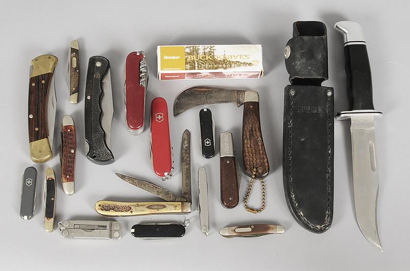 Eighteen Assorted Knives: 5 Buck, including Woodsman with leather sheath; 1 Barlow, 3 Schrade, 3 Case, 1 Leatherman, 4 Victorinox, 1 Multi Tool, blades range in size from 2 in. to 6 in.
