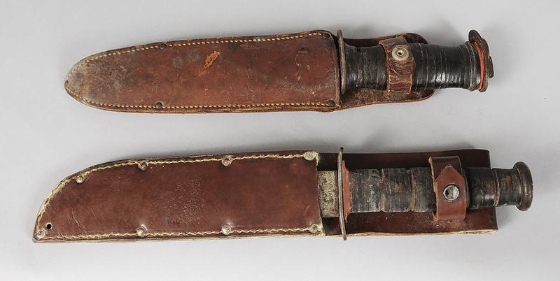 WWII Ka-Bar Fighting Knife/Miilitary Knife: one marked "KABAR/OLEAN N.Y.", other side marked "USMC", 7 in. blade, 12 in. overall, leather wrapped handle, leather scabbard, (blade with rust, no pitting, wear to leather scabbard); military knife,