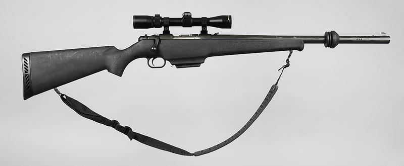 Mossberg Model 695 Bolt Action Slug Gun: 12 ga., 2-3/4 and 3 in. shells, S/N M121274, 22 in. rifled bore, ported barrel, barrel has parkerized finish, Limbsaver stabilizer, synthetic stock, 2 round detachable magazines, Nikon ProStaff 2-7X32