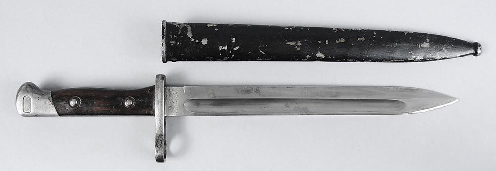German Manufactured Chilean Mauser Bayonet and Scabbard: ricasso stamped 'WEYERSBERG/KIRSCHBAUM & CO/SOLINGEN", guard stamped "L7091", "(K or R) 801", 10 in. blade, 14-3/4 in. overall, metal scabbard 10-3/4 in.˜