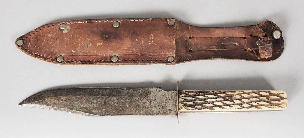Solins Original Bowie Knife: Japanese Solins "Original Bowie Knife", blade measures 5-3/8 in., overall length 9-7/8 in., brass guard, bone handle, leather case