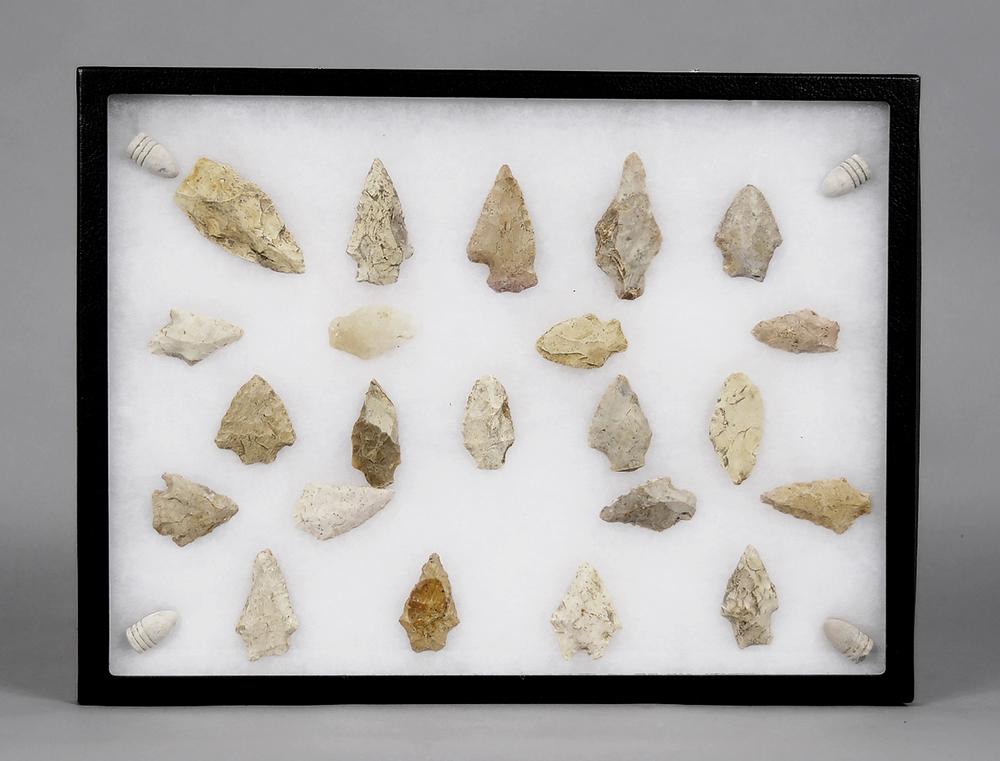Chattahoochee Arrowheads and Confederate Bullets: twenty-two arrowheads (said to be found along the Chattahoochee River in Alabama/Georgia), range in size from 1-5/8 in. to 3 in., four Confederate 3 ring Mini Ball bullets, 11 in. x 15 in. presentatio