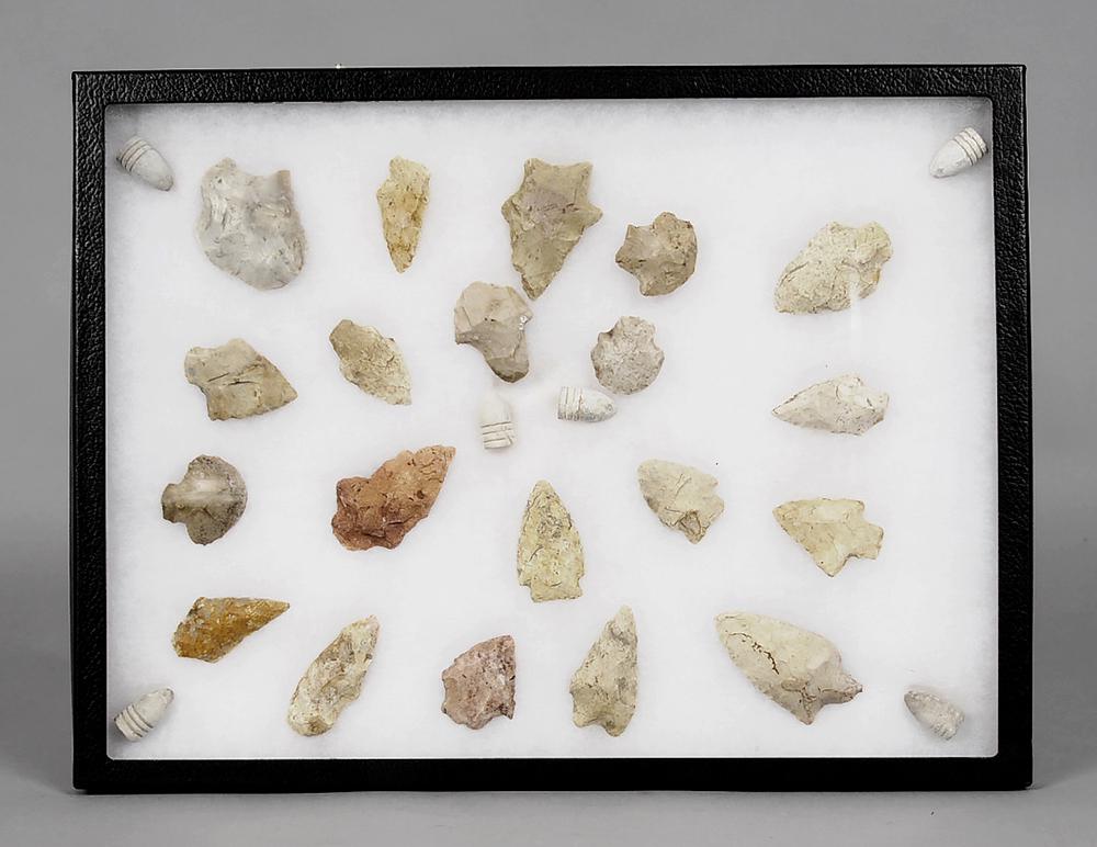 Chattahoochee Arrowheads and Confederate Bullets: twenty arrowheads (said to be found along the Chattahoochee River in Alabama/Georgia), range in size from 1-3/8 in. to 2-3/4 in., six Confederate 3 ring Mini Ball bullets, 11 in. x 15 in. presentation