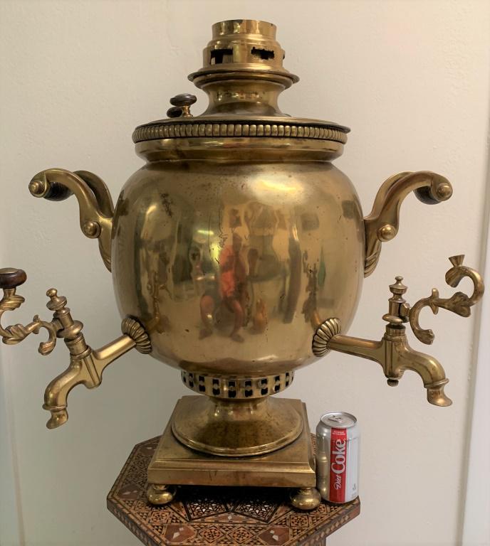 Large Antique Russian Brass Samovar: Large Antique Russian Brass Samovar. Features 2 spouts. Wood handles and knobs. Marked with makers mark. In need of a polish, one knob missing, typical dings and surface scratches from age and use. Me