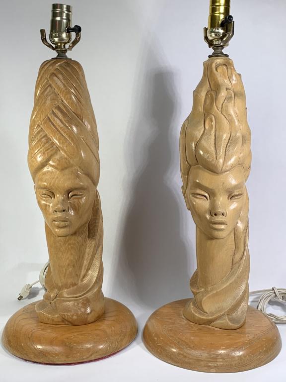 Pair Mid Century Carved Wood Exotic Women Lamps: Fabulous Pair of Mid Century Carved Wood Exotic Female Head Lamps. Remnants of old label, no other markings. Age cracks from age, wear from age and use. Harps included, no shades. Measures 18" to sock