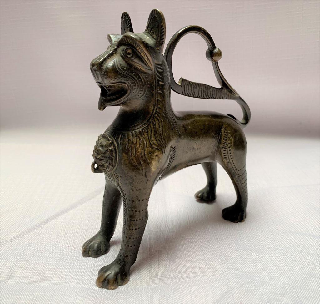 19th C German Aquamanile Lion Form Oil Lamp: 19th Century German Aquamanile Lion Form Oil Lamp. Unsigned. Measures 5" H x 5" L. Good condition. Domestic shipping $30.00 plus 2% insurance.