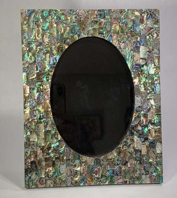 Tessellated Abalone Picture Frame: Tessellated Abalone Picture Frame. Unsigned. Very good condition. Measures 9-1/4" x 7-3/8", interior oval measures 6-1/4" x 4-1/2".