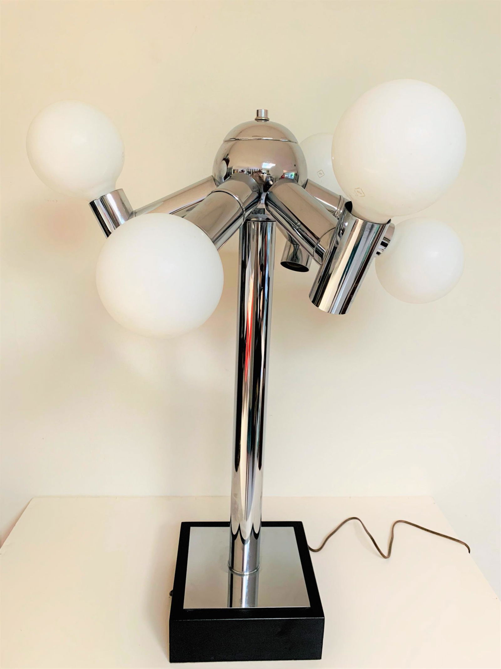 Robert Haussmann Table Top Atomic Lamp. Three way: Robert Haussmann Table Top Atomic Lamp. Three way lighting. Bulbs included but optional. Unsigned. Very Good condition. Measures 31" H x 22" W, 9" square base.