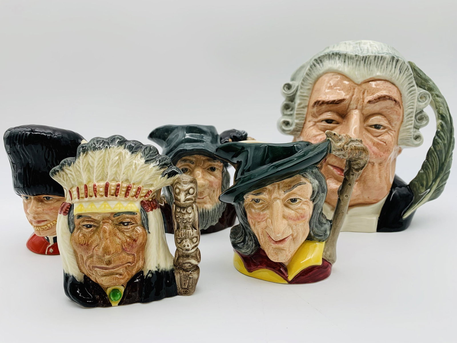5 Royal Doulton Toby Jugs. Includes: North American: 5 Royal Doulton Toby Jugs. Includes: North American Indian 4-1/2", The Guardsman 4-1/2", Rip Van Winkle 4", Pied Piper 4", The Lawyer 7". Very good condition.