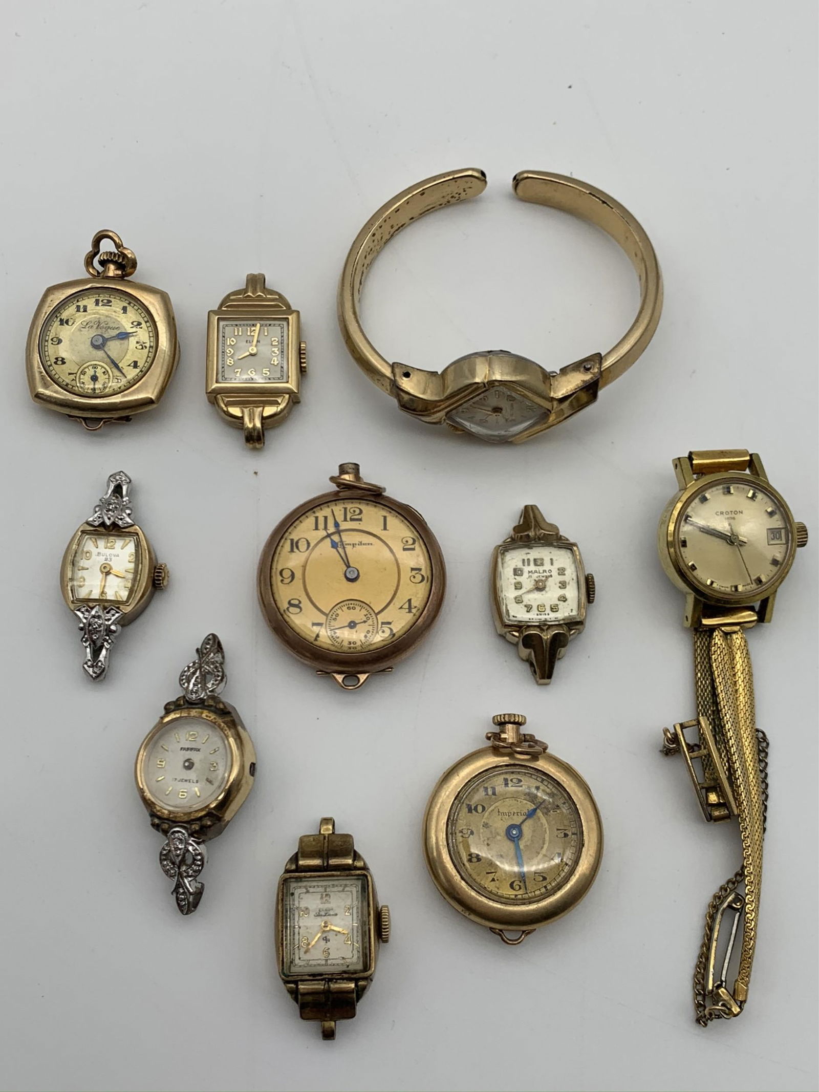 Lot of 10 Vintage Ladies Wrist Watches: Lot of 10 Vintage Ladies Wrist Watches. Includes: Campden, Le Vogue, Malro, Bulova, Fairfax, Elgin (2), Imperial, Hamilton w/band, Croton w/band. Various sizes. Theis lots is being offered "as is". We