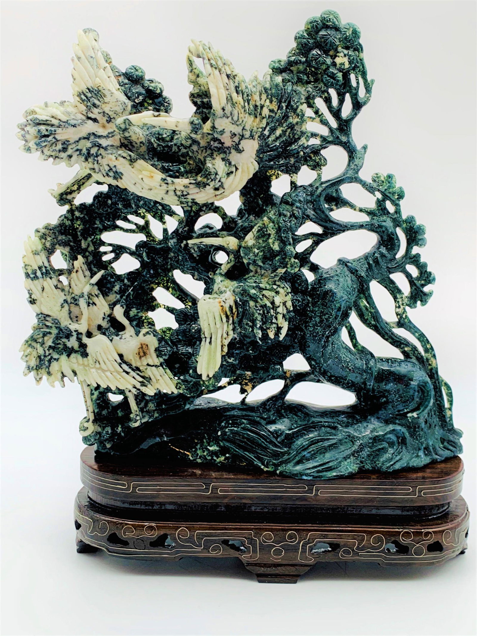 Chinese Honan Jade Sculpture: Antique Chinese Carved Honan Jade Figural Sculpture on Wooden Base. Birds and tree branch relief. Good condition. Sculpture measures 8-3/4" H x 8" W, stand measures 2" H x 8" W.