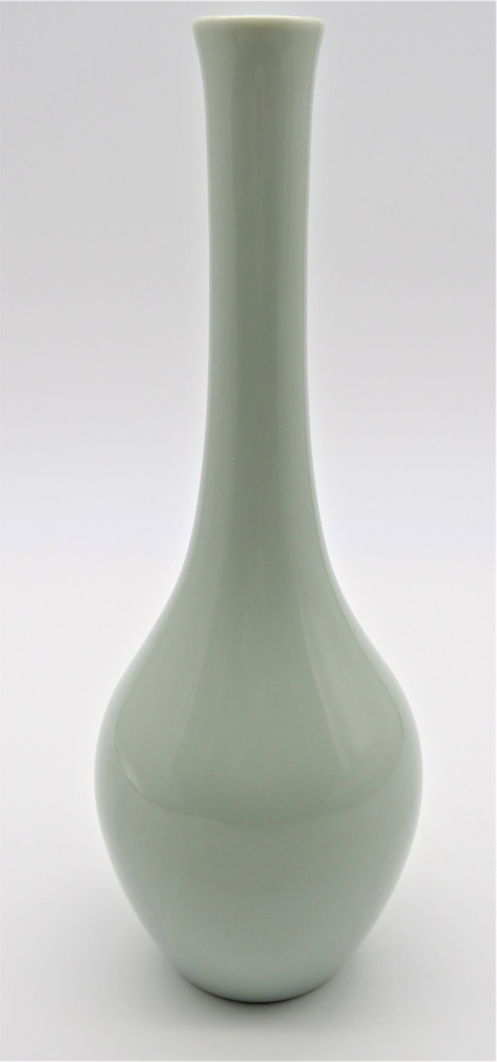 Korean Celadon Slender Vase: Korean Celadon Slender Vase. Lovely in it's simplicity. Unsigned. Good condition. Measures 9-3/4" H x 3-1/2" W.. Third party shipping.