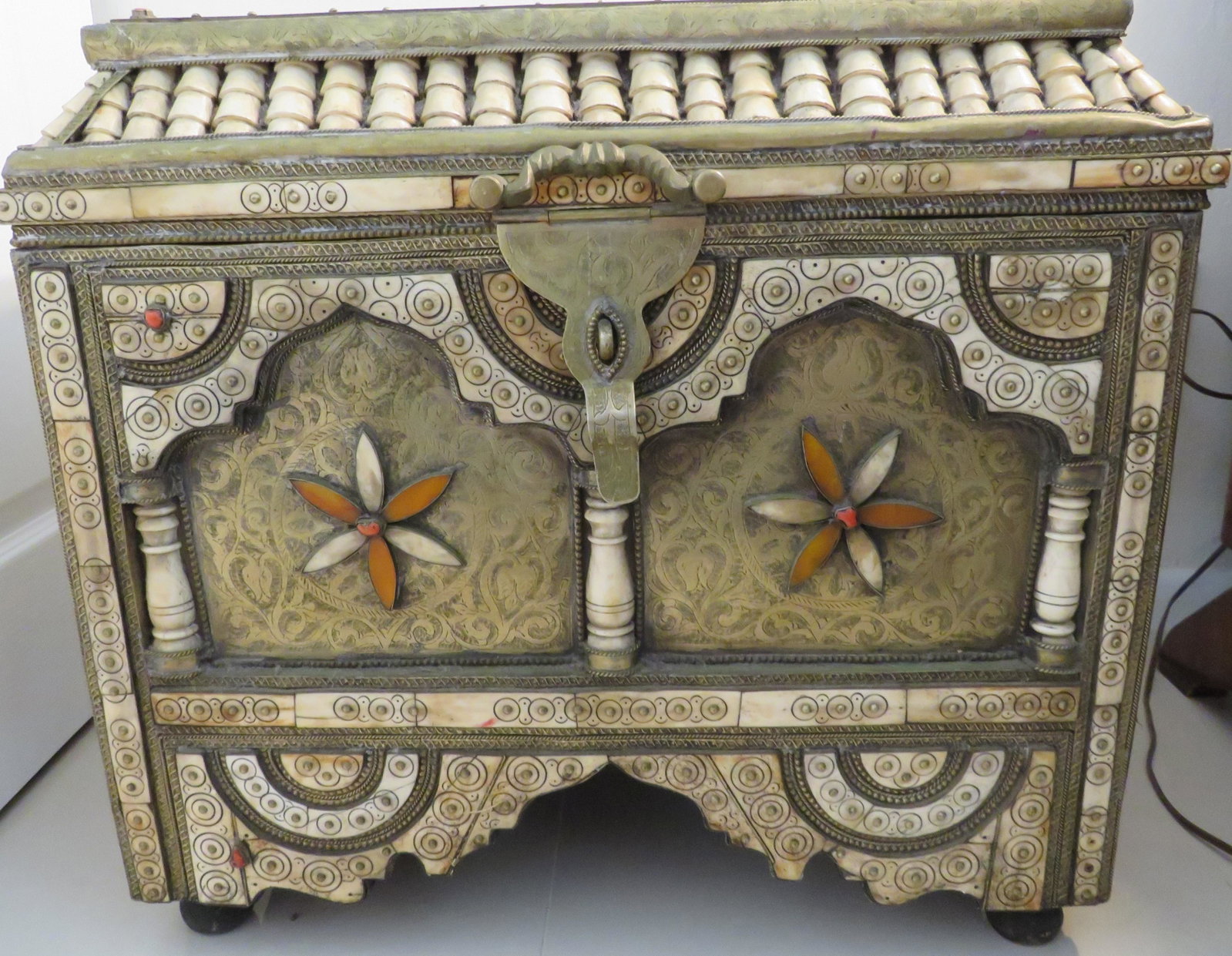 Antique Inlaid Camel Bone Chest: Antique Inlaid Camel Bone Chest. Accented with coral and silver like beads, leather lined. Unsigned. Good condition. Measures 20" H x 22" L x 14" D. Third party shipping