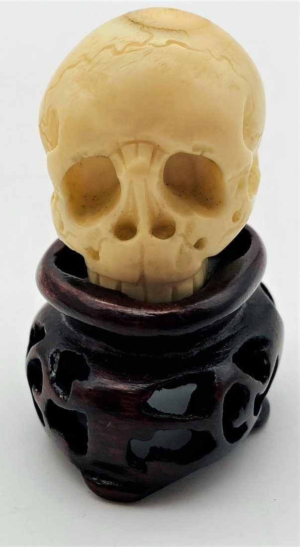 Antique Carved Skull Netsuke: Antique Japanese Carved Skull Netsuke On Stand. Some marking on top of skull. Good condition. No International Shipping. Skull measures 1" x 1-1/4". USPS Priority Shipping Available.