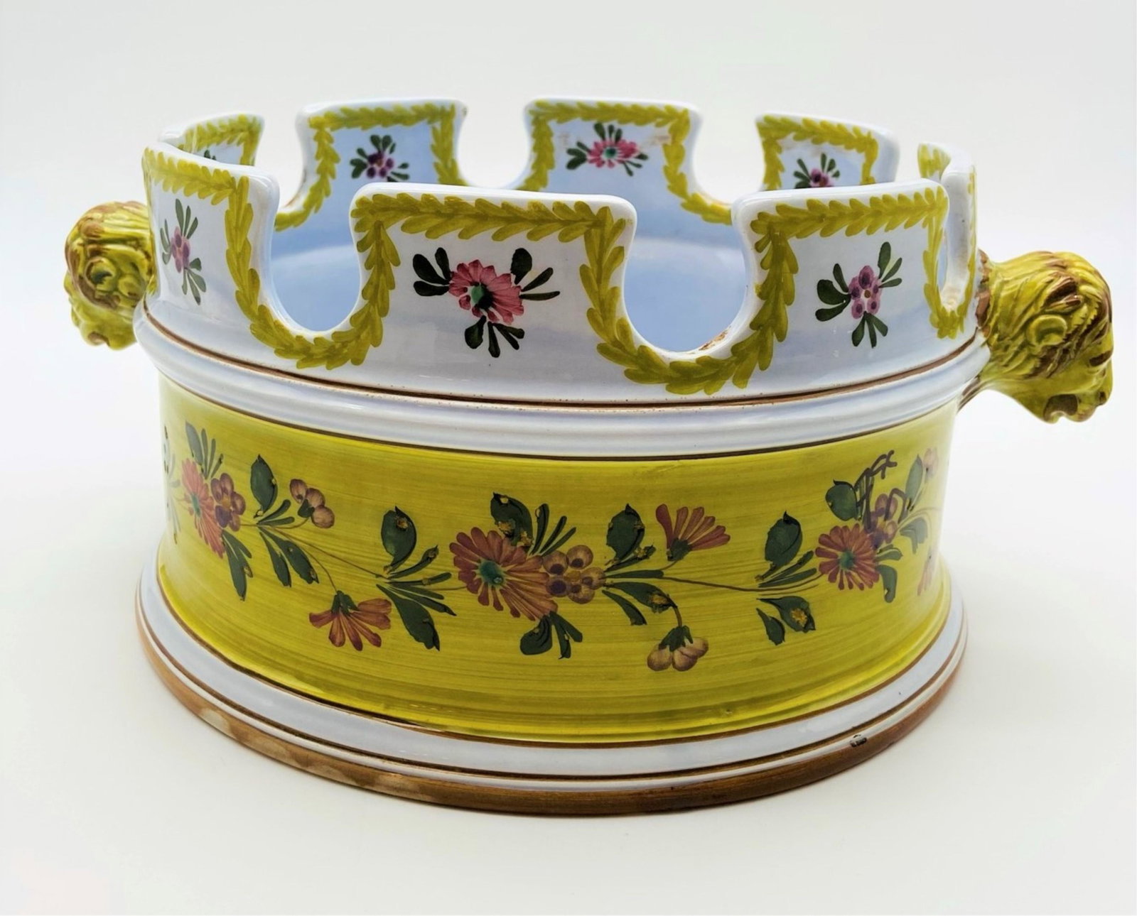 Vintage Majolica Pottery Centerpiece Bowl: Vintage Hand Painted Majolica Pottery Centerpiece Bowl. Figural knob handles, floral motif. Hand painted mark on bottom. Good condition, no chips, cracks or hairlines. Measures 5-3/4" H x 13" W. Third