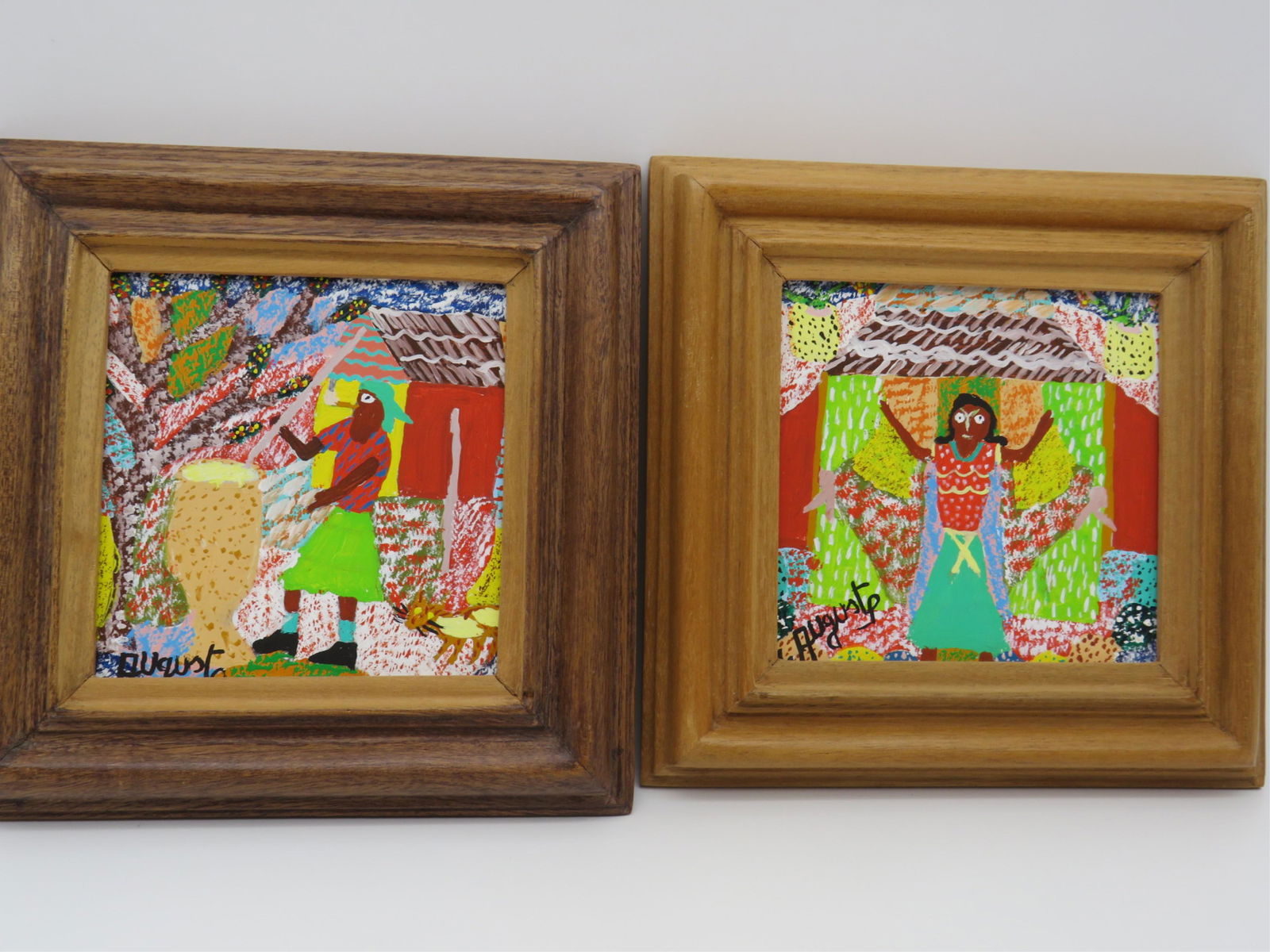 Two Georges Auguste Haitain Oil On Board: Two Georges Auguste Haitain (b. 1933) Oil On Masonite "Figural Scenes". Signed lower left. and numbered verso 92-857, 92-859. Framed stamped Made In Haiti. Measures 5" x 5", frames measure 7-1/2" x 7-