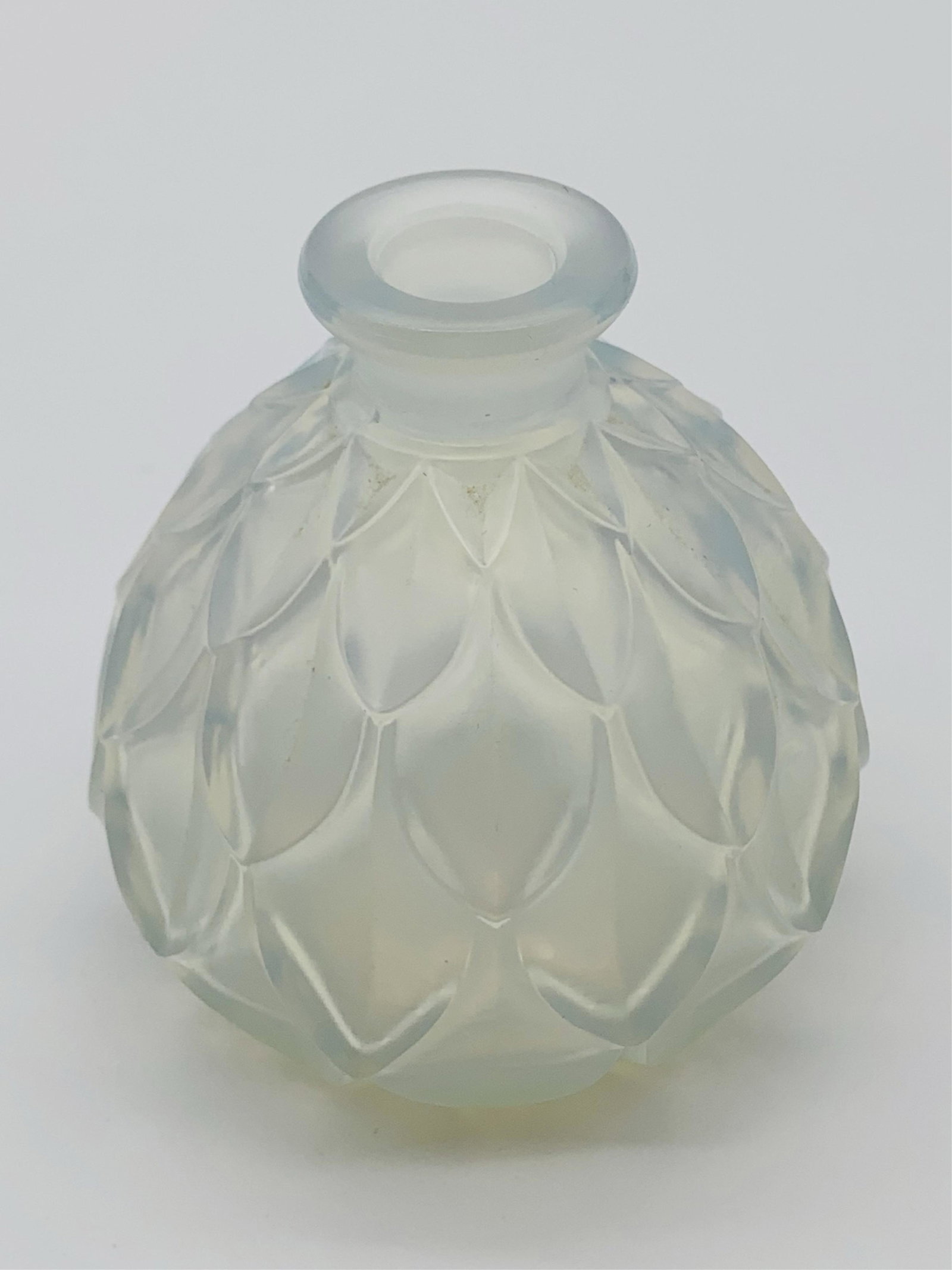 Deco Sabino Glass Perfume Bottle: Deco Sabino Iridescent Art Glass Perfume Bottle. Signed on the base. Missing stopper or in Good condition. Measures 3-1/2" x 3-1/8". Third party shipping.