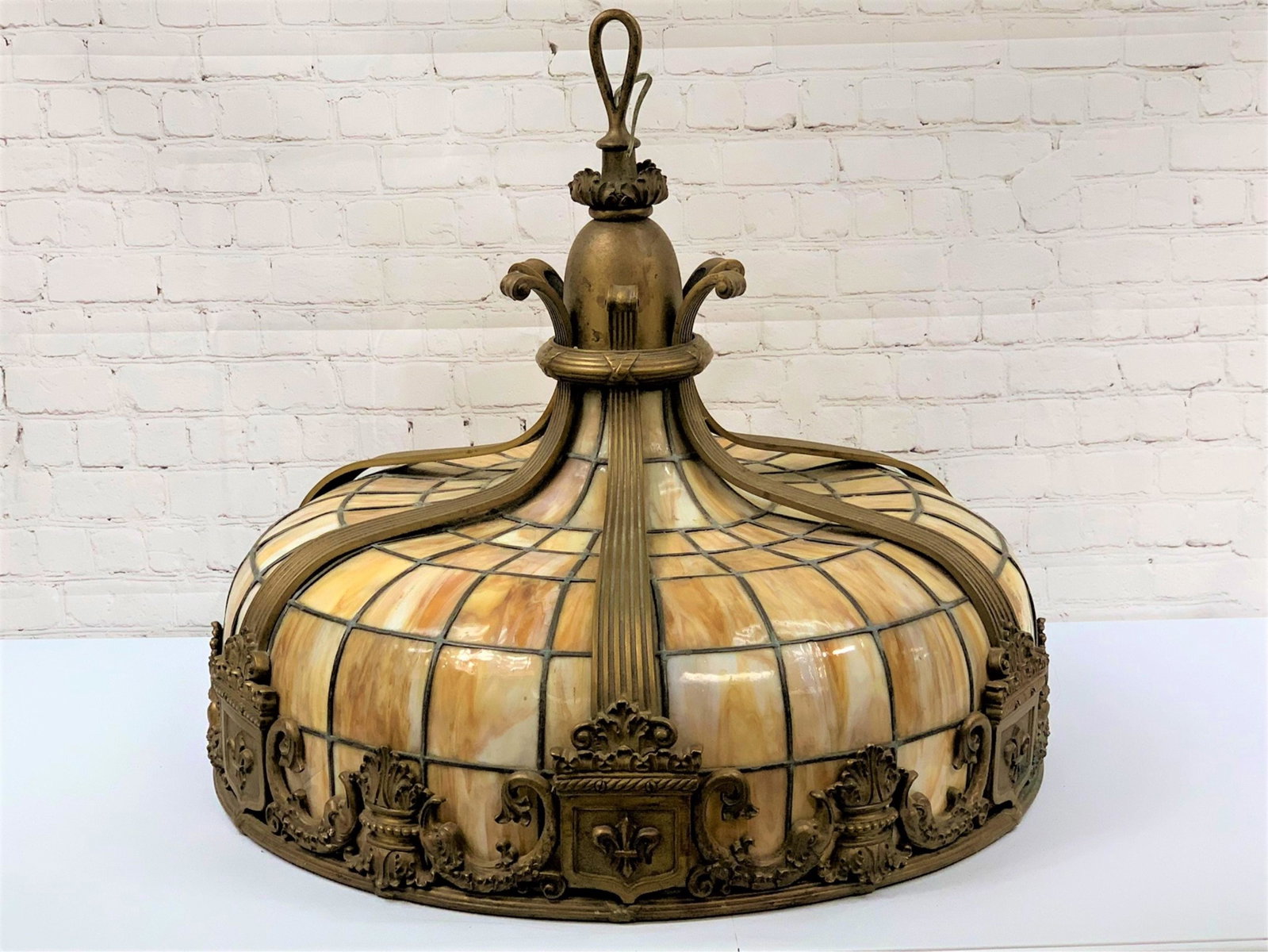 Duffner & Kimberly Bronze Slag Glass Lamp: Very Fine Large Duffner & Kimberly Gilt Bronze Slag Glass Hanging Lamp. Geometric dome in mottled butterscotch colored glass, the apron decorated with heraldic and dolphin motifs, fitted with a eight-