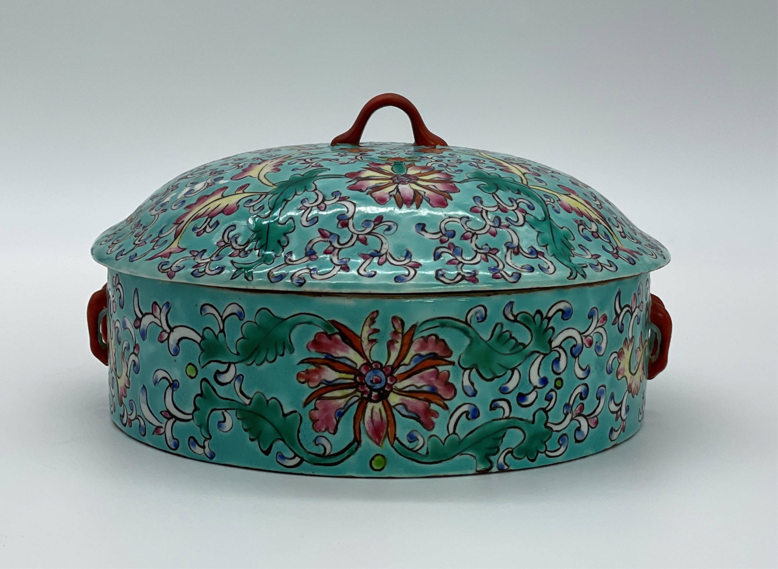 Vintage Chinese Porcelain Lidded Tureen: Vintage Chinese Porcelain Lidded Tureen. Colorful floral motif on turquoise ground. Signed with character marks on bottom. The lid with a small chip or in good condition. Measures4" H x 8" W. All Item