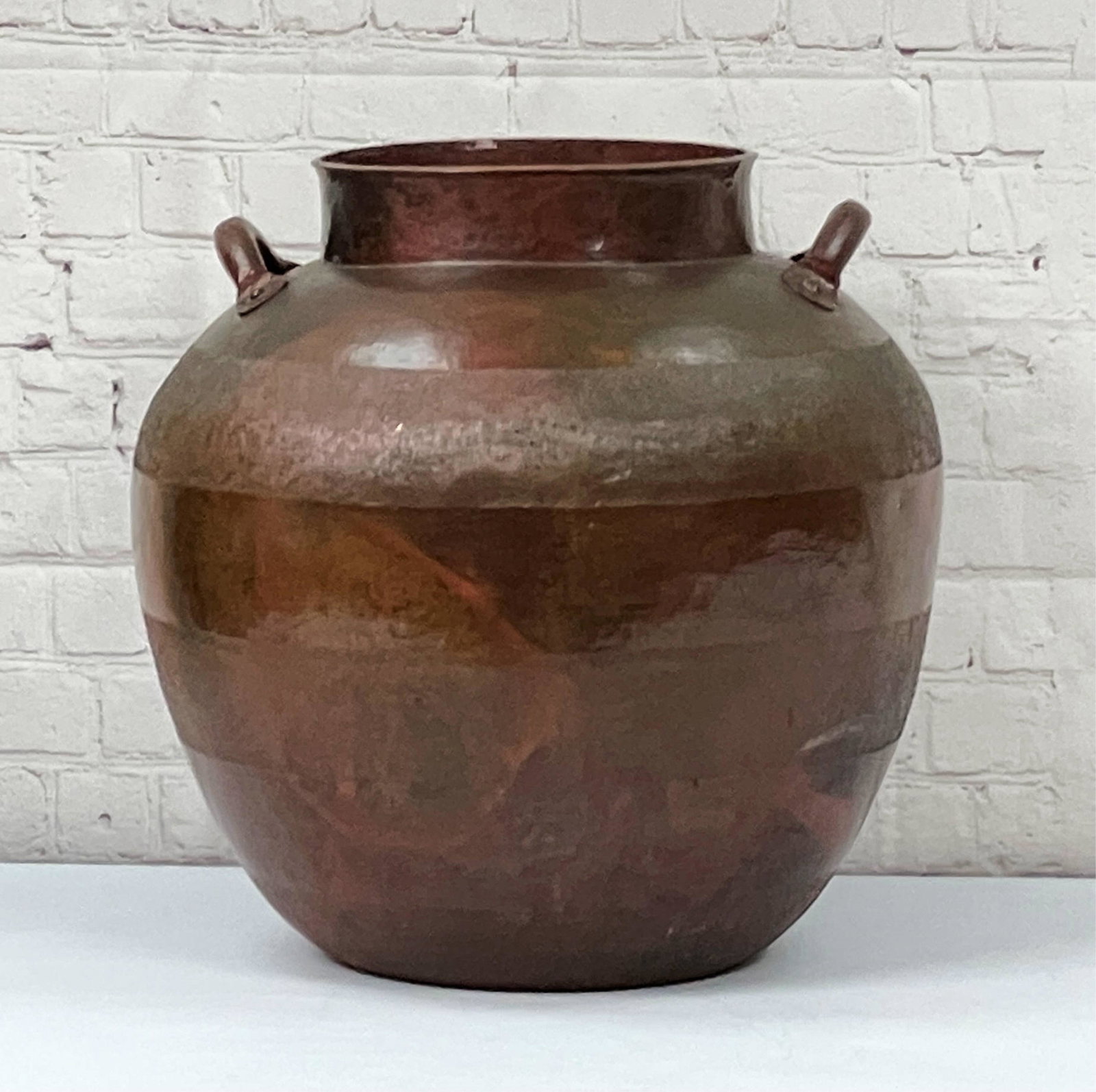 Large Vintage Hand Wrought Copper Pot: Large Vintage Hand Wrought Handled Copper Pot. Richly patinated and decorated with incised bands. Drilled drainage hole in bottom. Unmarked. Good condition with some scuffs from use. Measures 15-1/4" 