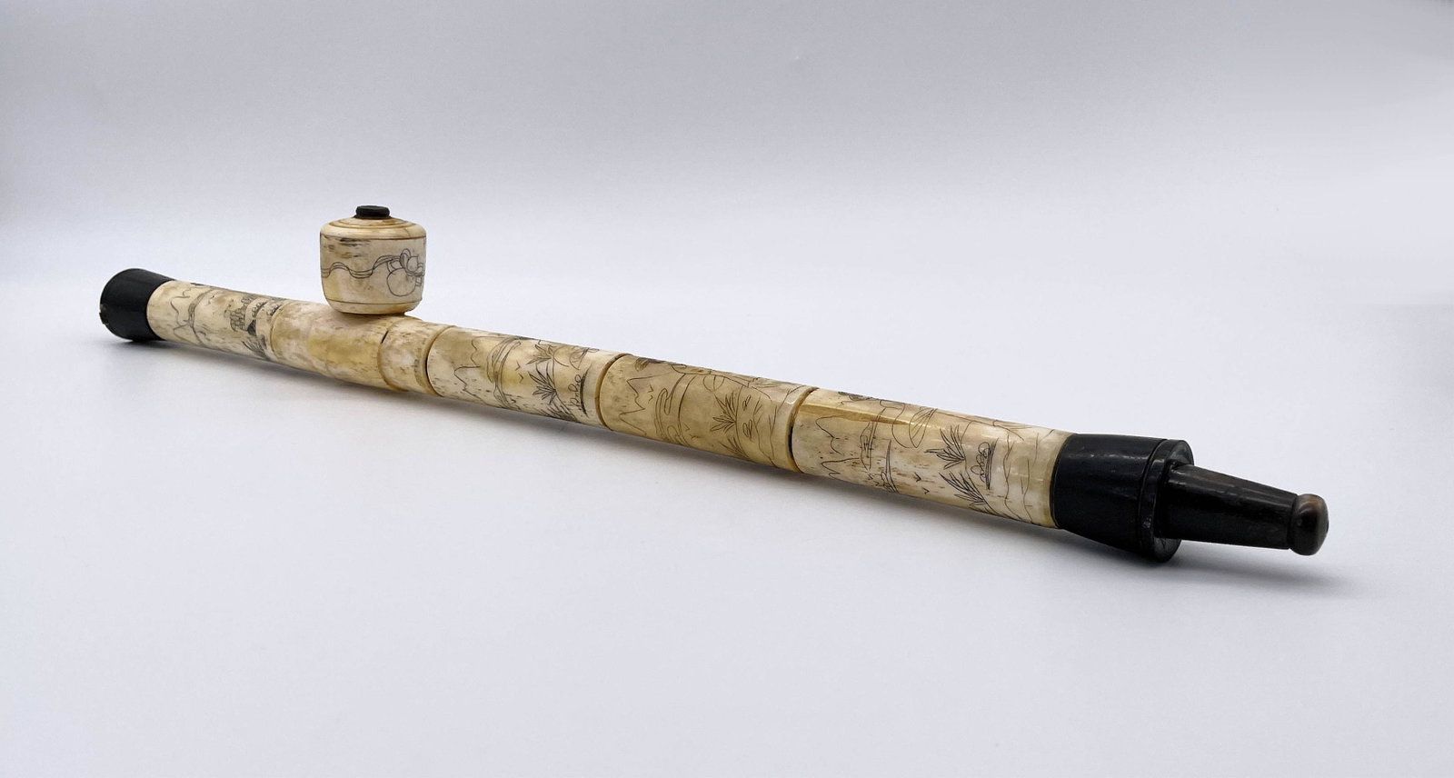 Antique Chinese Incised Bone Opium Pipe: Antique Chinese Incised Bone Opium Pipe. Decorated with figural motif. Unsigned. Measures 20-1/4" L. Good antique condition. All Items Are Third party shipping or free local pick-up within 60 days of 