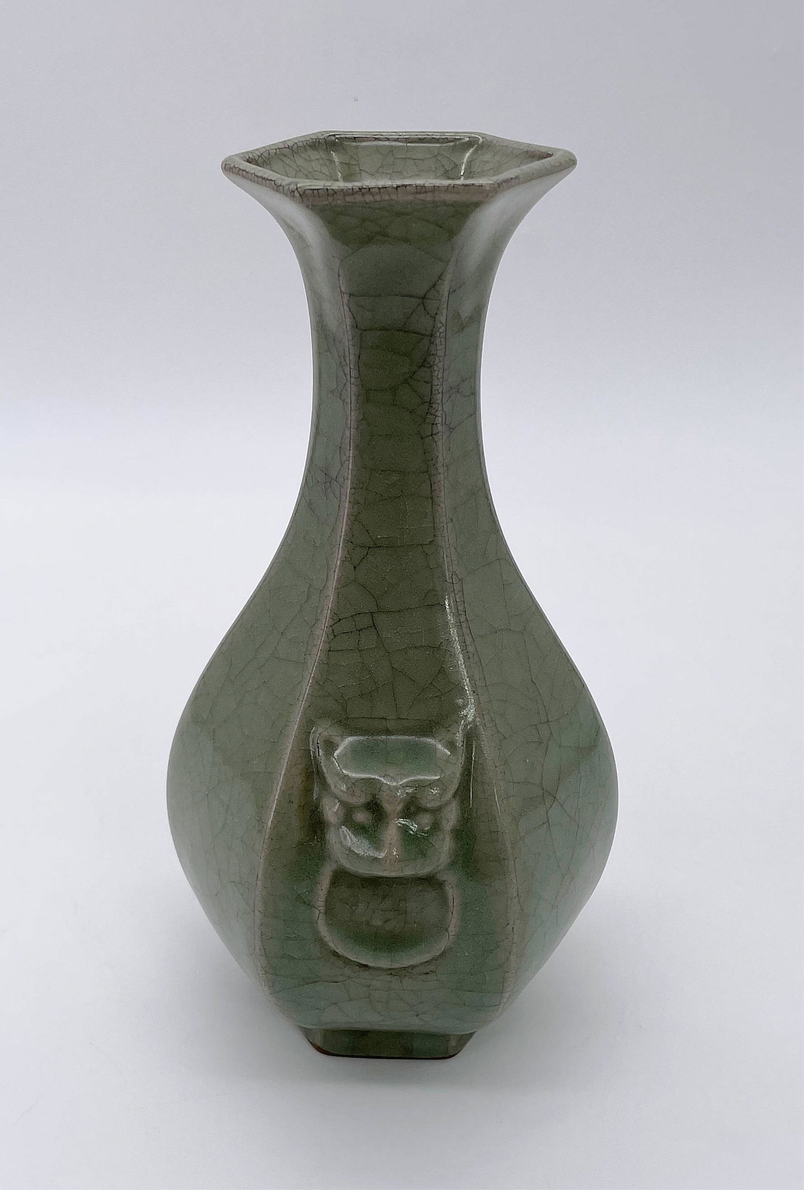 Chinese Longquan Ware Celadon Vase: Chinese Longquan Ware Celadon Crackle Glaze Vase. Mock figural ring handles. Raised marks on bottom. Good condition. Measures 8-3/4" H x 5" W. All Items Are Third party shipping or free local pick-up